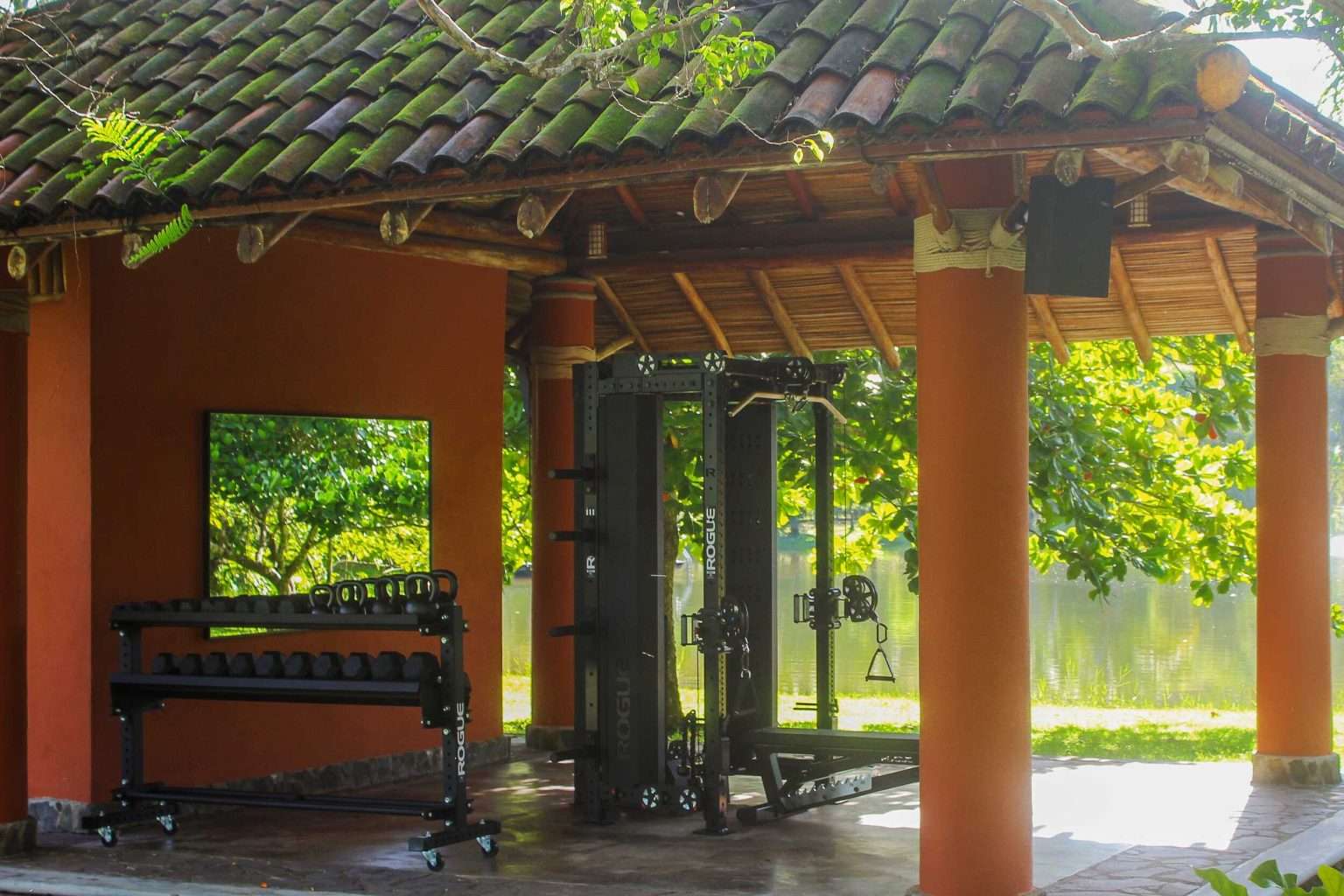 Open-air multi-gym with modern equipment surrounded by tropical nature in Costa Rica.