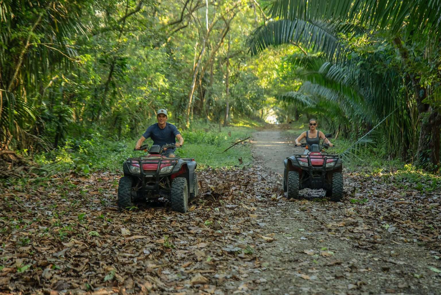 Adventurer exploring a lush Costa Rican jungle during a luxury travel experience.