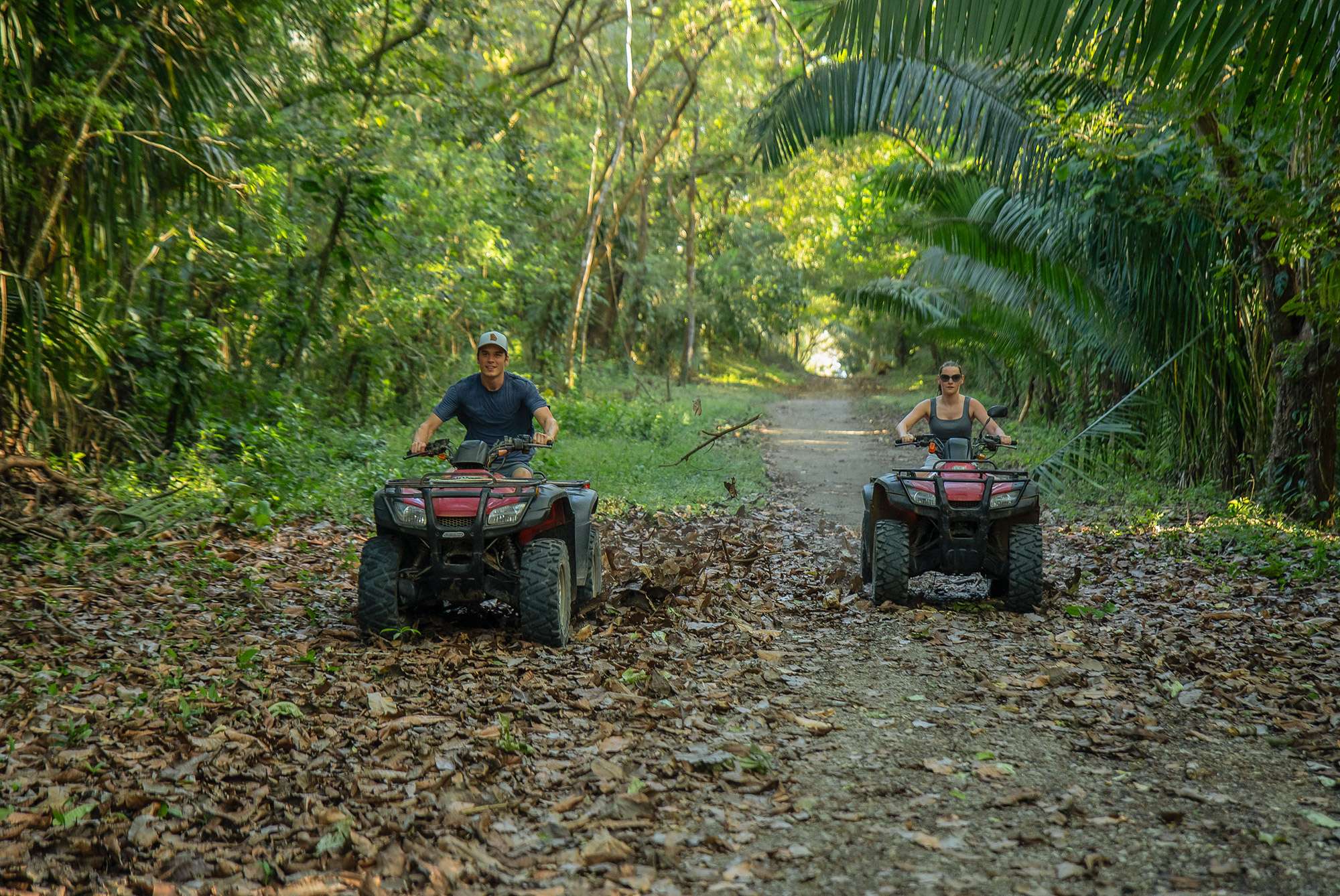Adventurer exploring a lush Costa Rican jungle during a luxury travel experience.