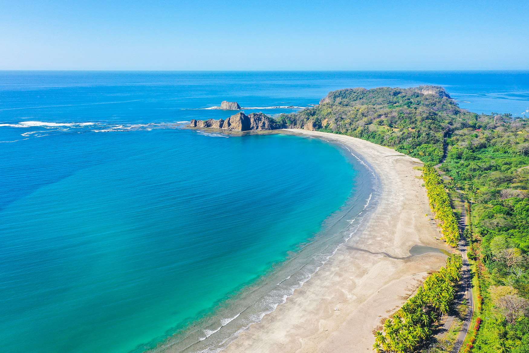 Tropical beach scene with luxury homes at Ventanas del Mar, Playa Carrillo