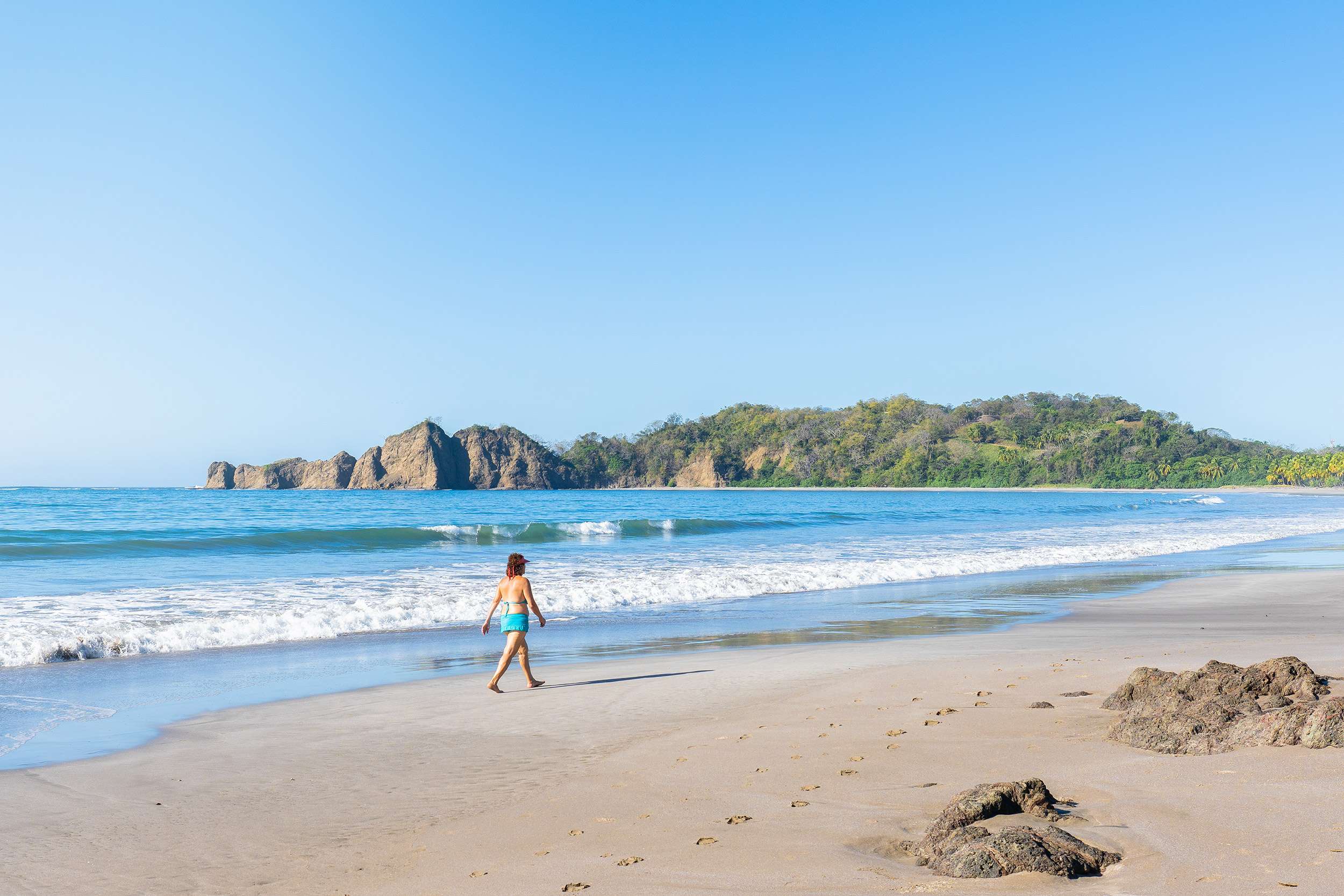 Adventurer exploring a lush Costa Rican jungle during a luxury travel experience.