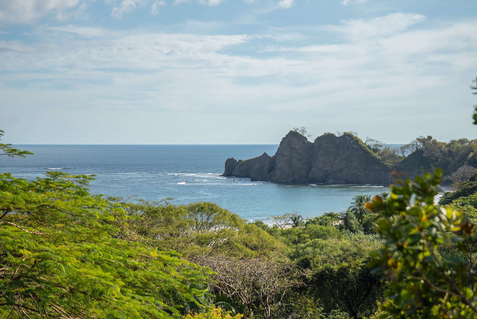 Luxury coastal home in Playa Carrillo, Costa Rica, surrounded by lush greenery and ocean views