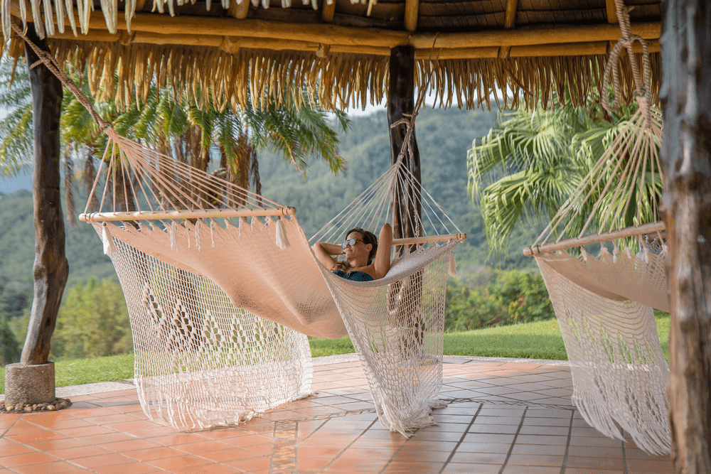 Outdoor hammock lounge at Ventanas del Mar in Costa Rica, where guests unwind while enjoying panoramic tropical views.